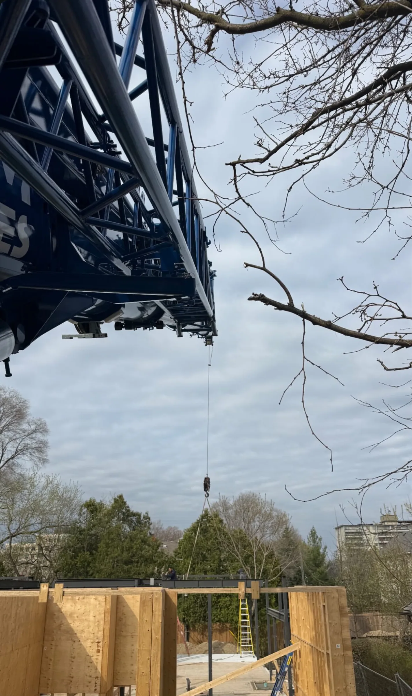 Crane boom working above formwork on a JTM Cranes jobsite